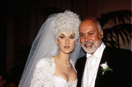 Celine Dion in a wedding gown poses with her husband Rene Angelil.